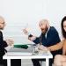 Men in a heated discussion at a table